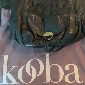 Kooba black shoulder bag with loads of pockets.